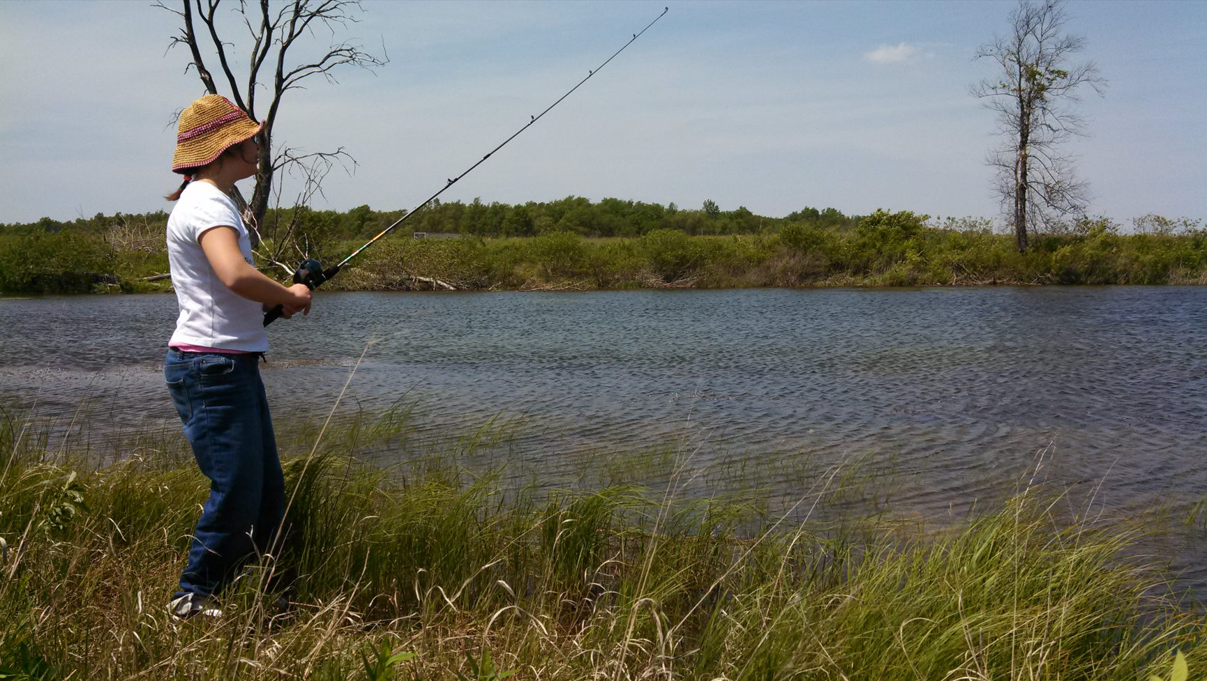 Child fishes at Beaver Lake