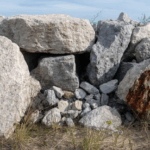 Stones put in place to try to halt the erosion of sand along the Lake Michigan shoreline in Ogden Dunes, Indiana, Tuesday, April 29, 2025.