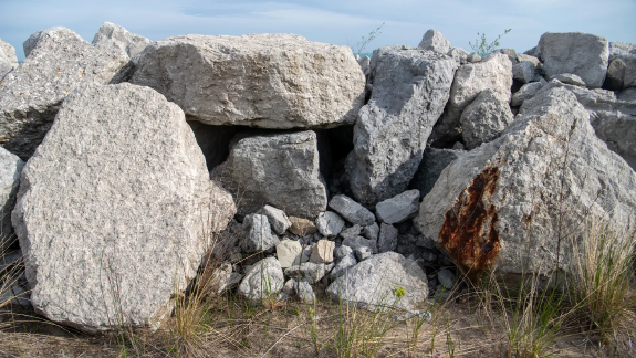 Stones put in place to try to halt the erosion of sand along the Lake Michigan shoreline in Ogden Dunes, Indiana, Tuesday, April 29, 2025.